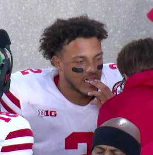 Martinez gets looked at after the hit in East Lansing.